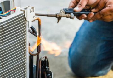Close up of Air Conditioning Repair use fuel gases and oxygen to Man fixing AC